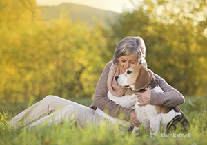 Woman with her dog during the fall season